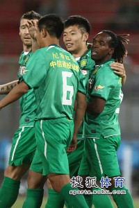 guoan players celebrate a goal