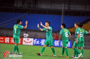 Zhou Ting and Wang Changqing celebrate a goal