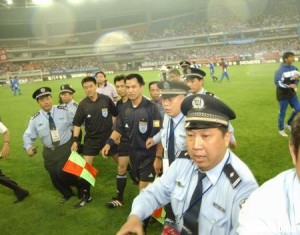 Referee escorted from the field after a Shenhua - Inter match