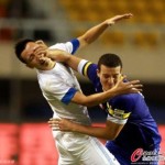 The referee and linesman deemed this push on Xu Bo's face by Nabil Baha not even worthy of a freekick