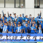 Guangzhou R&F fans enjoying themselves in the otherwise quiet Yuanshen stadium