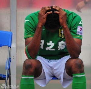 Mahama Awal hangs his head as his Guangdong Sunray Cave side miss the chance of promotion to the CSL 