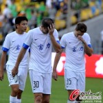 Disappointed Guangzhou R&F players leave the field after loosing to Beijing