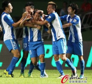 Cantonese hero Lu Lin is congratulated by his teammates