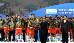 Still Going Strong: Sun Jihai (holding trophy) won't be with Guizhou next season, but he'll still be in the Super League