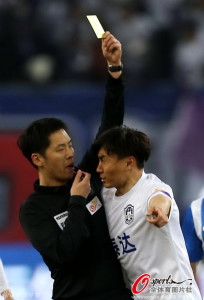 Tianjin's Li Weifeng demonstrates his respect for the referee 