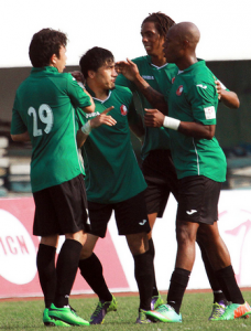 Xinjiang players celebrate Bari Mamatil's goal