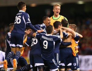  Melbourne celebrate their injury-time clincher.