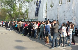 The new fans line up before entering Gongti