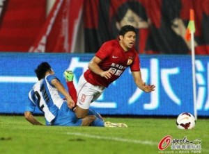 Elkeson is tripped by a sliding Chang Feiya