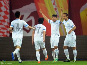 Yu Hanchao celebrates scoring his second for Dalian against Evergrande in April