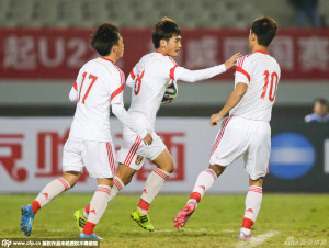 Liao Lisheng (with ball) celebrates scoring a penalty against Brazil in 2014