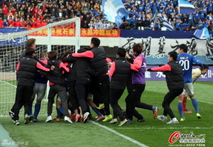 Going Up: Players and staff celebrate Gargarov's late penalty  