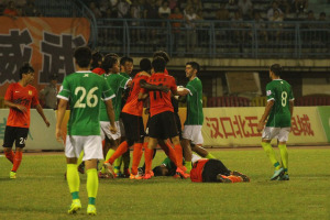 No Need to Overreact: Zhu Ting (11) is restrained in the melee caused by his shove on Yi Lin (grounded)