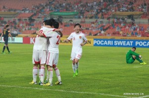 More Of The Same Please: Chinese players celebrate a goal against Australia in the East Asian Cup 