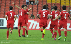 Match Winner: Yu Hai (21) celebrates his deflected free kick against Saudi Arabia 