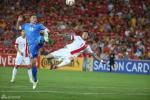 High Flyer: Zhang Linpeng in action against Uzbekistan