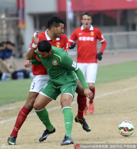 Early Struggles: Hebei's Abdurahim Laajab (9) tussles with BIT's Abel Nazario 