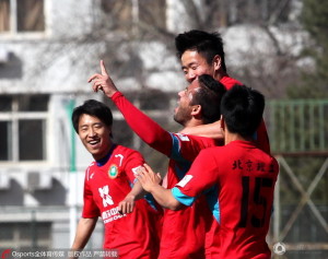 Beijing Institute of Technology players celebrate Marquez's opener