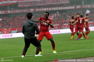 Jean Kouassi bagged an 88th minute winner against Chongqing to put his side top of the league.