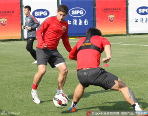 Darío Conca in training this week - still wearing the strapping on his calf following his nasty injury in Tianjin.