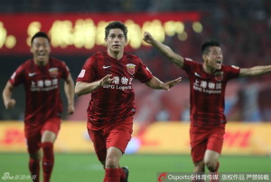 Darío Conca celebrates putting his side in front on the stroke of half time