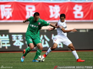 Unhappy Return: Cristian Danalache (10) tussles with Qingdao's Jorge Claros