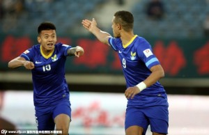 Mathias Ranegie celebrates one of his goals with Jin Qiang