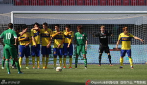 Any Means Necessary: Hainiu players distract Cristian Danalache (10) from scoring by playing peek-a-boo and grabbing their crotches