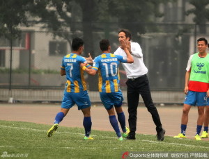 Welcome Aboard: Liu Qing (7) and Mario Lucio (10) celebrate with new manager Goran Tomic