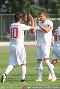 Finally: Igor Burzanovic celebrates becoming Hunan's first foreign goalscorer of the season with captain Stevan Bates