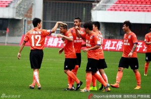 Jiangxi players celebrate Jaja's goal