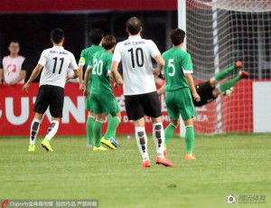 Nenad Milijas (10) watches on as Song Wenjie (11) heads in Hebei's opener