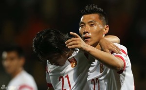 Super Sub: Yu Dabao (22) celebrates with Beijing Guo'an teammate Song Boxuan