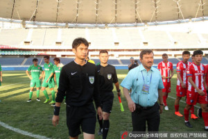 Over zealous referee Ai Kun leaves the field at the end of the game