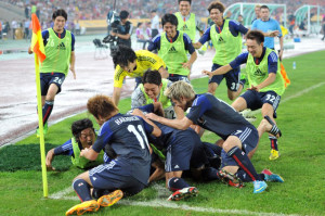 Japan celebrate the last minute goal from ??? which made them 2013 East Asian champions