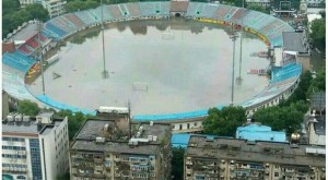 Wuhan's Xinhua Road Stadium (pictured last Thursday) shows the potential damage heavy summer rains can do in the city