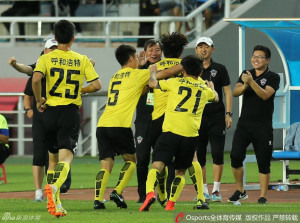 Hohhot players and staff celebrate Lin Kun's eqaualiser