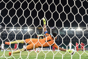 Wang Yongpo scores China's second from the penalty spot