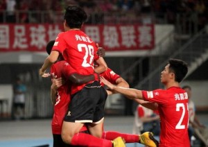 Yu Shuai (28) celebrates with goal scorer Babacar Gueye