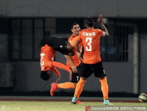 Jiangxi's Leo Itaperuna celebrates scoring for just the second time this season against Guizhou Zhicheng as Adi Rocha (7) and Demerson (3) look on 