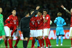 You Have To Laugh: Paulinho looks amused by the referee's decision to award a penalty against Evergrande