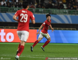 Zheng Long celebrates his goal as fellow super-sub Gao Lin looks on