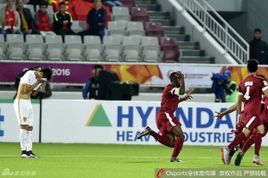 Qatar left-back Abdelrakim Hassan celebrates a goal against China t the Asian under-23 Championships 