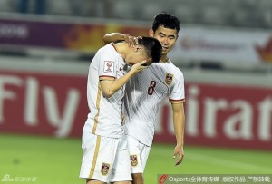 Mi Haolun, whose error led to Syria's decisive penalty, is comforted by Guo Hao after the match