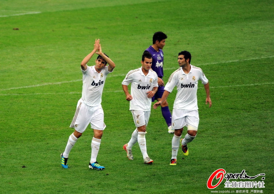 Tianjin players celebrate a goal